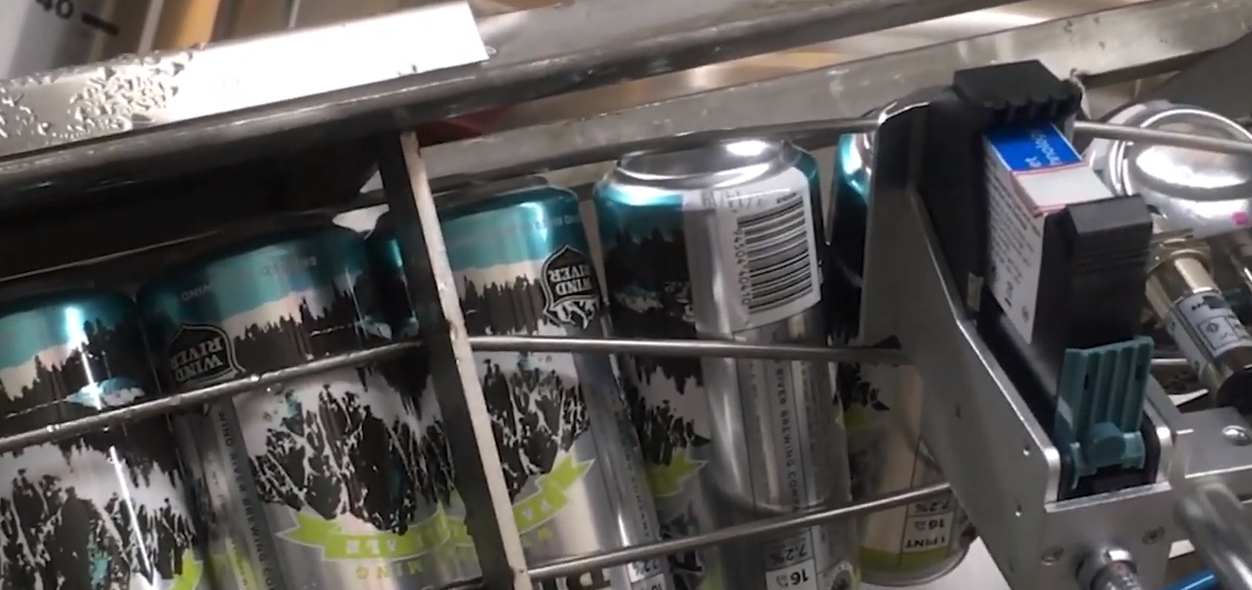SNEEDJET Inkjet printer codes beer cans on twist rinse cage